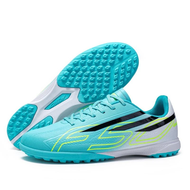 Aqua and white low-cut turf football boots