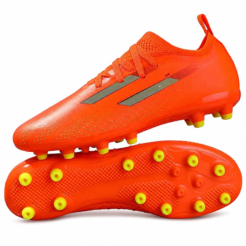 Solar orange artificial-grass football boots